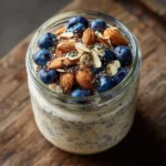 Protein overnight oats in a jar with blueberries and almonds