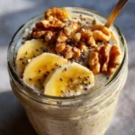 Banana paleo oats with walnuts and chia seeds in a glass jar